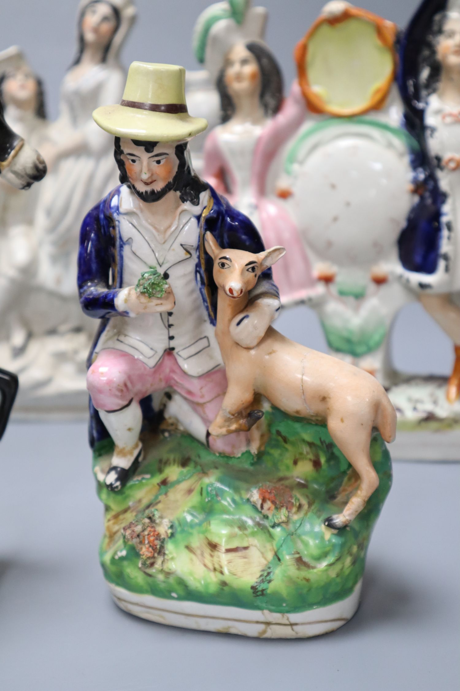 Five 19th century Staffordshire pottery figures including Dick Turpin, later 24cm